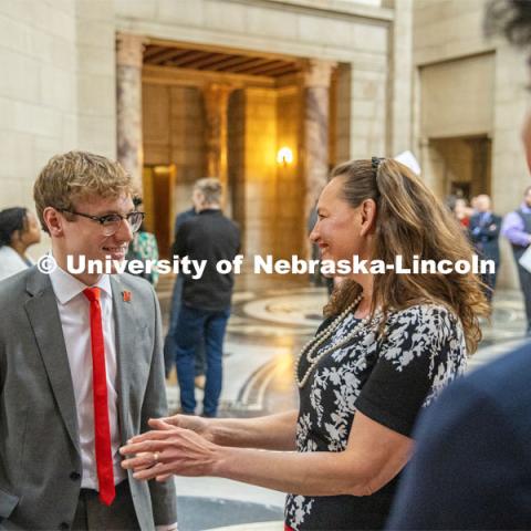 Student Body President and Student Regent, Paul Pechous (left), chats with Senator Danielle Conrad during I Love NU Day at the Nebraska State Capitol. March 6, 2024. Photo by Kristen Labadie / University Communication.